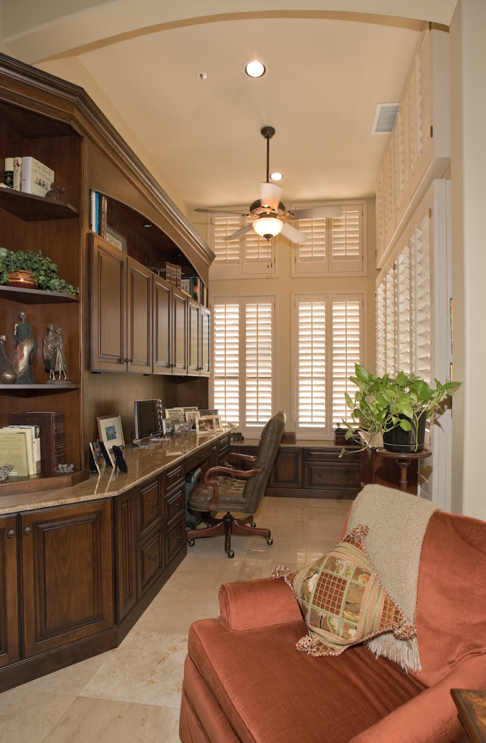 Elegant home office with dark wood cabinetry